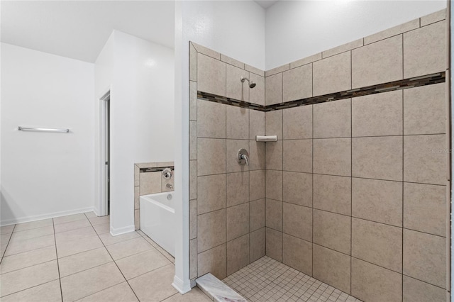 bathroom with tile patterned floors and independent shower and bath