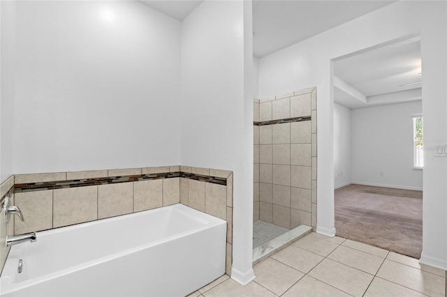 bathroom featuring tile patterned floors and a tub