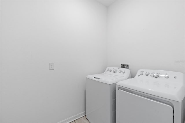 laundry area with separate washer and dryer