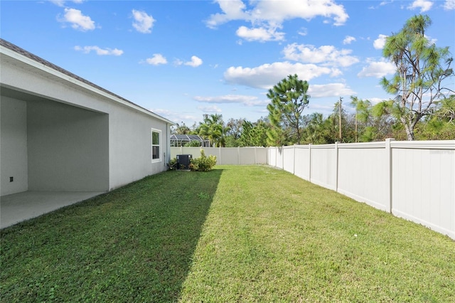 view of yard featuring central AC unit