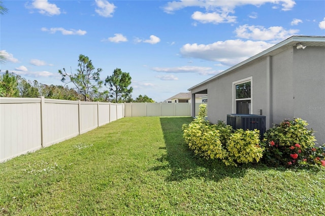 view of yard featuring central AC