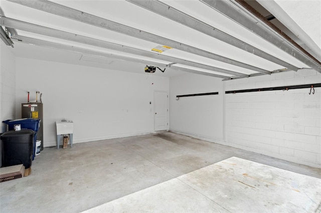 garage with electric water heater and a garage door opener