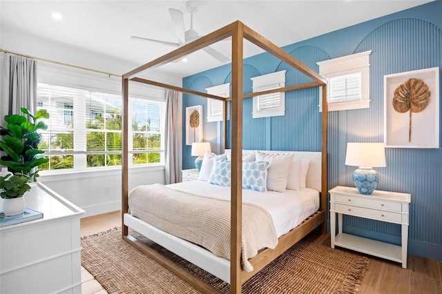 bedroom featuring hardwood / wood-style flooring and ceiling fan