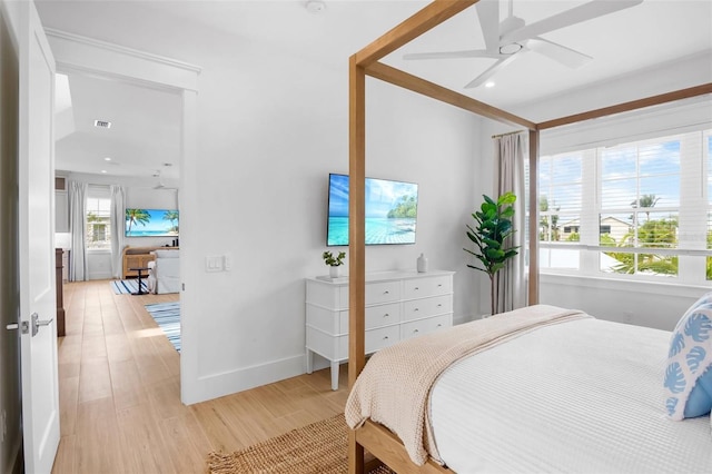 bedroom featuring ceiling fan and light hardwood / wood-style flooring