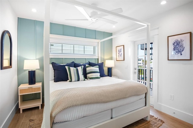 bedroom with hardwood / wood-style flooring and ceiling fan