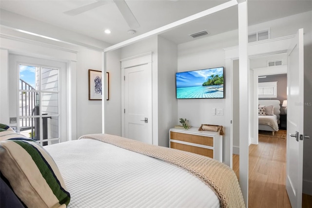 bedroom featuring hardwood / wood-style floors and ceiling fan