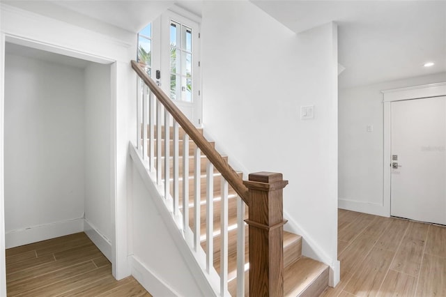 stairway featuring hardwood / wood-style flooring