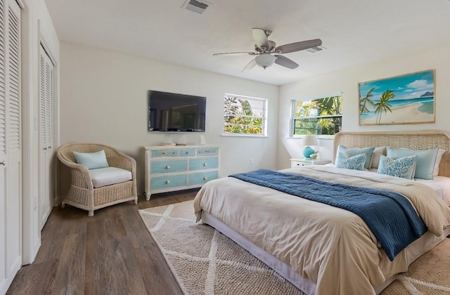 bedroom featuring dark hardwood / wood-style flooring and ceiling fan