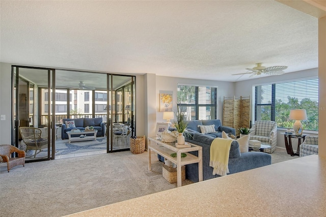 8779 Midnight Pass Rd Unit 206H, Sarasota, FL 34242 - carpeted living room with a ceiling fan and a textured ceiling
