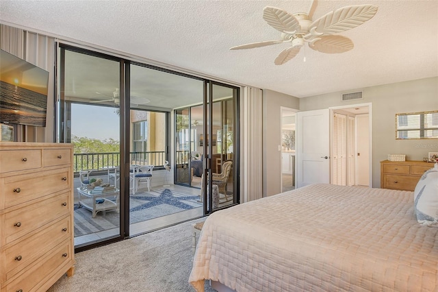 8779 Midnight Pass Rd Unit 206H, Sarasota, FL 34242 - bedroom featuring access to outside, light colored carpet, a textured ceiling, floor to ceiling windows, and a ceiling fan