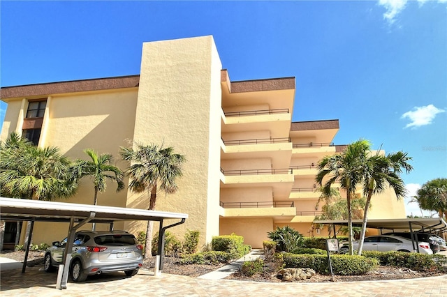8779 Midnight Pass Rd Unit 206H, Sarasota, FL 34242 - view of property featuring covered parking