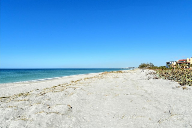 property view of water featuring a beach view