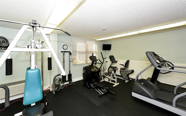 workout area featuring a textured ceiling