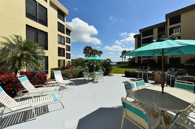 view of swimming pool with area for grilling and a patio