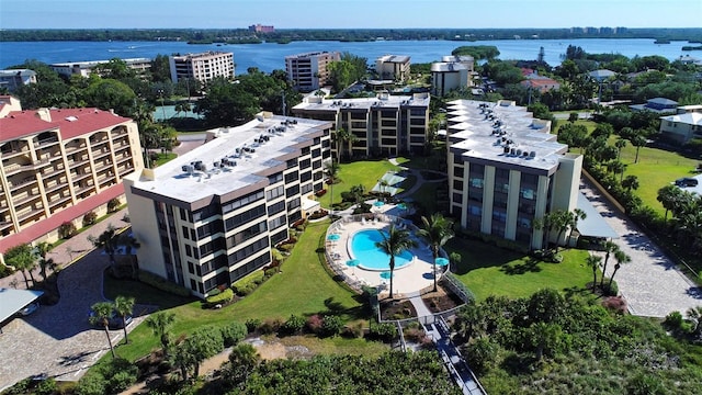 8779 Midnight Pass Rd Unit 206H, Sarasota, FL 34242 - bird's eye view of a pool area, apartment complex, and a large body of water