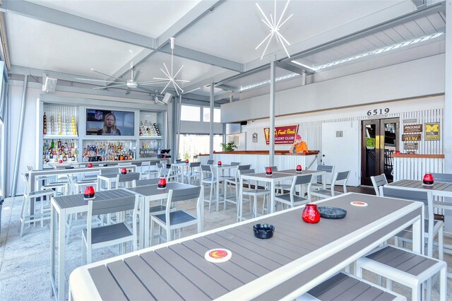 playroom featuring beamed ceiling and ceiling fan