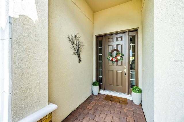 6249 Mesa Gln, Bradenton, FL 34203 - doorway to property with stucco siding
