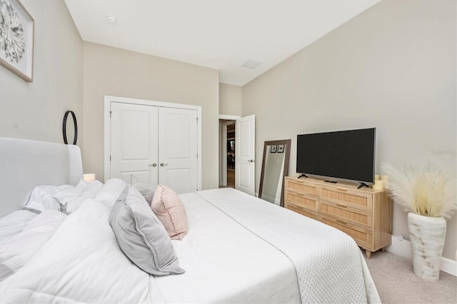 bedroom with carpet flooring and a closet