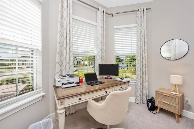 carpeted office with a healthy amount of sunlight