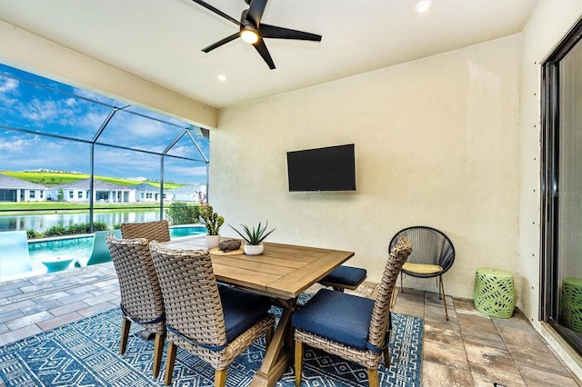 6249 Mesa Gln, Bradenton, FL 34203 - view of patio with ceiling fan, an outdoor pool, a water view, and glass enclosure