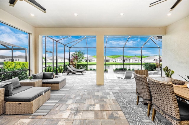 sunroom / solarium with a water view