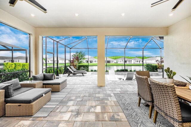 6249 Mesa Gln, Bradenton, FL 34203 - view of patio featuring a ceiling fan, a residential view, outdoor lounge area, and glass enclosure