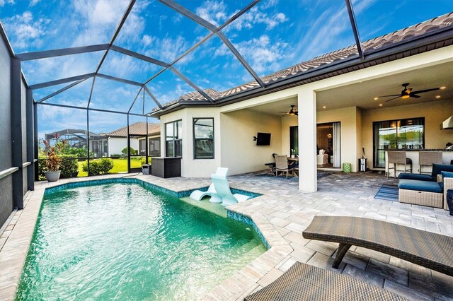 6249 Mesa Gln, Bradenton, FL 34203 - outdoor pool featuring a patio area, ceiling fan, and a lanai