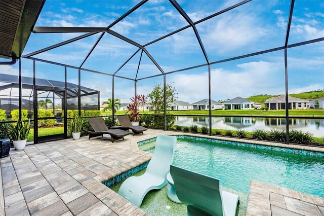 6249 Mesa Gln, Bradenton, FL 34203 - outdoor pool featuring a patio area, a water view, glass enclosure, and a residential view