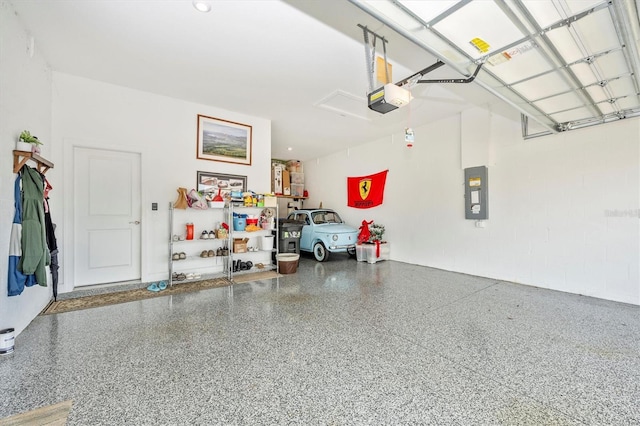 garage with electric panel and a garage door opener