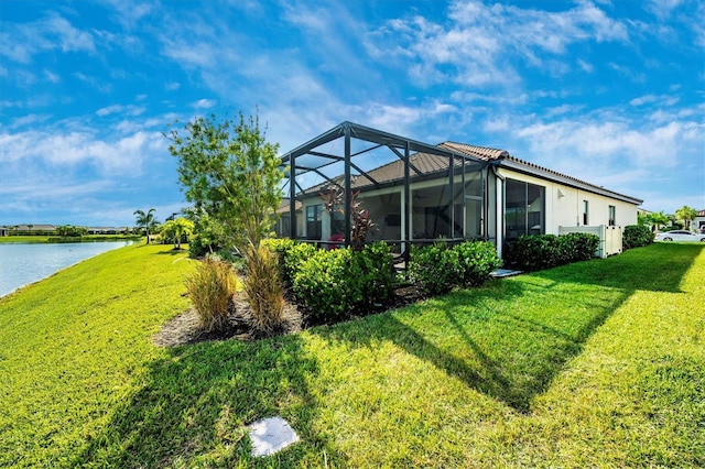 6249 Mesa Gln, Bradenton, FL 34203 - rear view of property with a yard, a water view, and glass enclosure