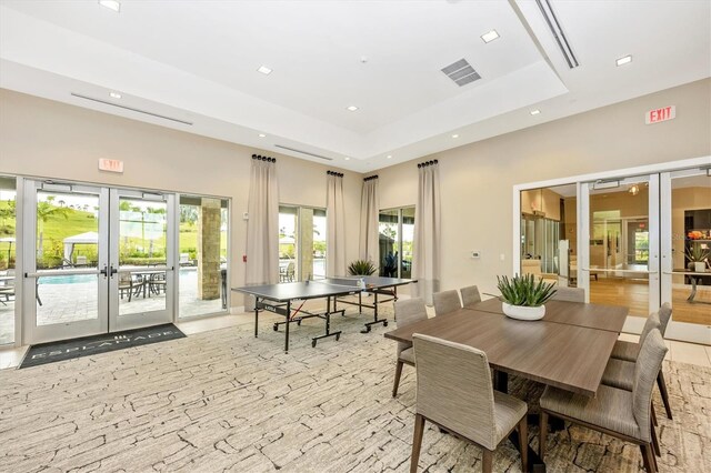 6249 Mesa Gln, Bradenton, FL 34203 - dining area with french doors, a raised ceiling, and recessed lighting