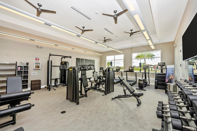 gym with light colored carpet and ceiling fan