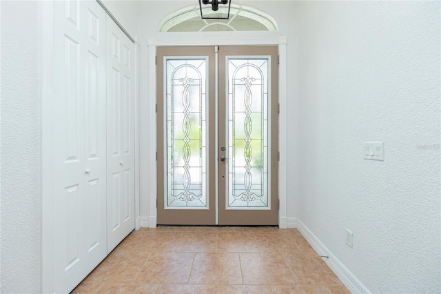 foyer with a healthy amount of sunlight and french doors