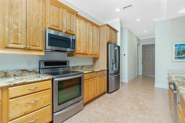 kitchen with light stone counters, light tile patterned floors, crown molding, and appliances with stainless steel finishes