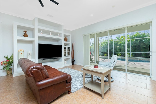 living room with light tile patterned floors, built in features, and ceiling fan