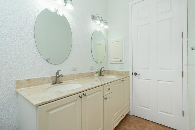 bathroom featuring tile patterned floors and vanity