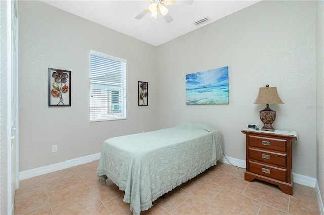 bedroom with light tile patterned floors and ceiling fan