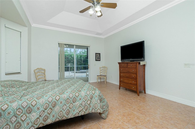 tiled bedroom featuring crown molding, a tray ceiling, access to outside, and ceiling fan