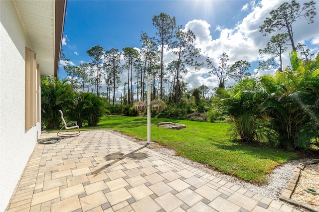 view of patio / terrace with an outdoor fire pit