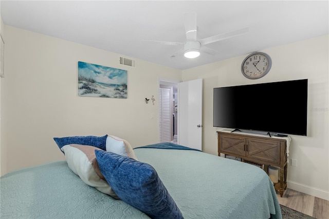 bedroom with hardwood / wood-style floors and ceiling fan