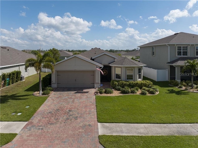 view of front of home featuring a front lawn and a garage