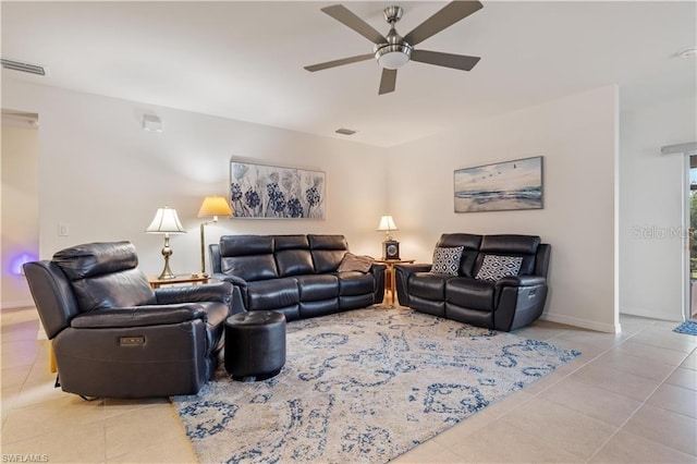 tiled living room featuring ceiling fan