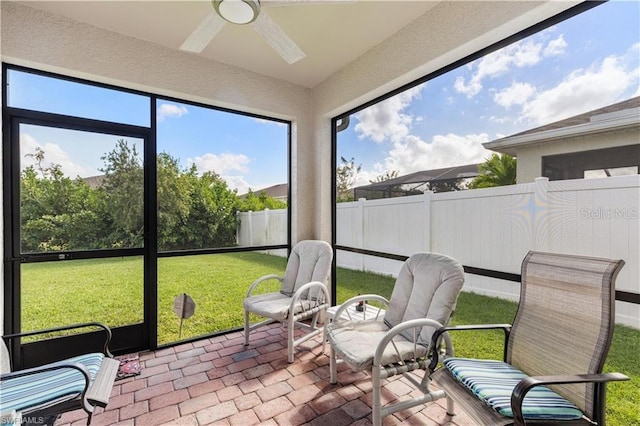 sunroom / solarium with ceiling fan