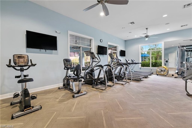 gym with ceiling fan and light carpet