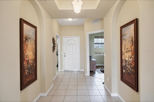 hall featuring light tile patterned floors