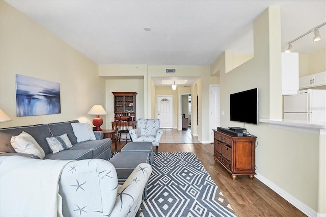 living room with hardwood / wood-style floors