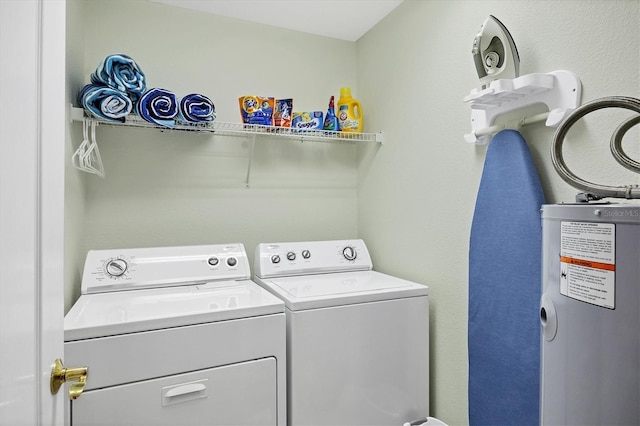 980 Cooper St Unit 302, Venice, FL 34285 - laundry area featuring independent washer and dryer and water heater