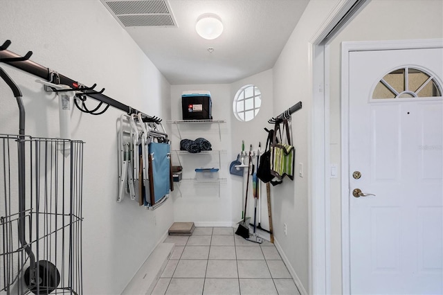 980 Cooper St Unit 302, Venice, FL 34285 - foyer featuring light tile patterned floors and baseboards