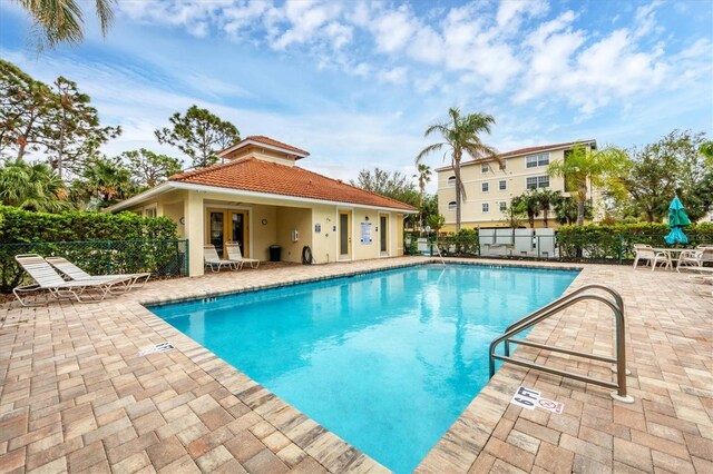 980 Cooper St Unit 302, Venice, FL 34285 - community pool with a patio area