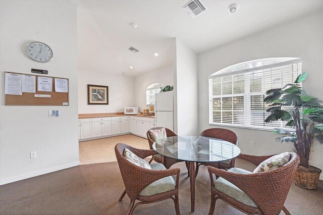 980 Cooper St Unit 302, Venice, FL 34285 - dining area with light colored carpet and recessed lighting
